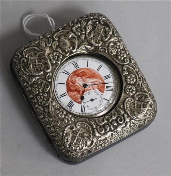 An Edwardian repousse silver mounted travelling watch case with Swiss silver pocket watch.